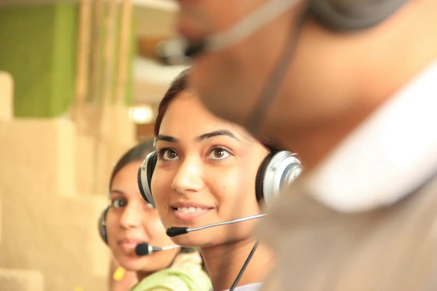 Support specialist with a headset ready to answer project enquiries